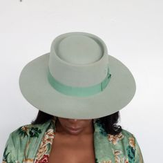 Turn heads & grab everyone’s attention in the Kayo Boater Hat in mint green. Highlighted in a calming mint green hue, it’s designed with an elongated brim, round top, and bow band for a dainty touch. Hand embroidered with BTR initials. 100% Australian Wool Adjustable inner band for sizing 4” Crown Height 3.25” Brim Multiple colors SHIPPING POLICY We process your order in 24-48 hours. Hats typically ship within 3-5 business days, or sooner. Expedited shipping options are available at checkout. We Fitted Felt Hat With Flat Crown For Spring, Fitted Top Hat With Flat Crown For Spring, Green Hat Bands For Kentucky Derby, Adjustable Green Fedora For Spring, Adjustable Green Flat Brim Fedora, Green Adjustable Wide Brim Fedora, Adjustable Green Wide Brim Fedora, Adjustable Green Wide-brim Fedora, Adjustable Wide Brim Green Felt Hat