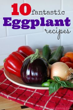 an eggplant on a plate with other vegetables