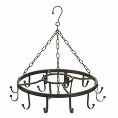 a metal circular hanging pot rack with hooks