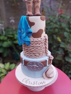 a cake made to look like a cowboy hat and boots