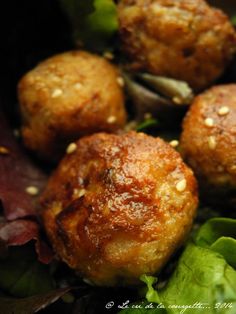 some meatballs are sitting on top of lettuce