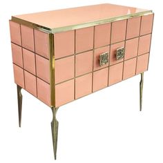 a pink and gold chest with two doors