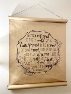 a gold wall hanging with a quote on it