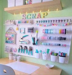 a craft room with pegboard and lots of craft supplies