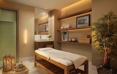 a spa room with a wooden bench and white towels on it