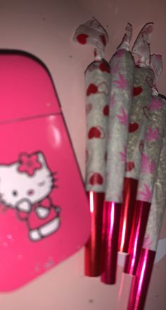 pink hello kitty pencils are lined up next to each other with hearts on them