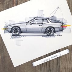 a drawing of a car on top of a piece of paper