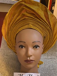 African Nigerian Metallic/Cotton Aso Oke, auto gele, ready to wear gele, African hat, traditional wedding hat, pre-tied headgear, headwrap, Head-tie.  * Material/Fabric: Metallic and Cotton * Adjustable Velcro/plaster straps behind. * Aso Oke , Women  * Size: One size fits most * Classic turban style, Solid color * Auto-gele  African head tie of Nigerian  * 100% brand new and high quality Traditional Yellow Adjustable Headwrap, Traditional Adjustable Yellow Headwrap, Adjustable Yellow Headband Costume Hat, Yellow Adjustable Headpiece For Church, Adjustable Yellow Headpiece For Church, Yellow Headband Headwrap For Wedding, Yellow Headwrap For Wedding, Yellow Adjustable Headband, Adjustable Yellow Headband