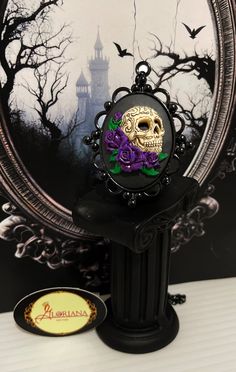 "The perfect accent to your outfit! - These Skull and Roses pendants are carefully hand detailed to create a look that will stand out amongst the rest! - The Rose colors currently come in Yellow, Blue, Red, Pink and Purple! (See our other listing for Yellow, Blue and Red!) -*MESSAGE ME IF YOU WOULD LIKE THE PINK AND OR PURPLE IN THE GOLD TONE BACKING!* - The Cameo's are set in a Black Plated Decorative Bezel.   - They come with a Black Plated Stainless Steel cable chain. DIMENSIONS: PENDANT BACK Gothic Jewelry With Skull Print For Gift, Purple Halloween Jewelry Gift, Skull Print Necklace For Halloween Gift, Gothic Skull Print Necklace For Gifts, Gothic Purple Jewelry For Halloween, Skull Jewelry For Day Of The Dead Party, Skull Shaped Jewelry For Day Of The Dead Party, Purple Rose Design Jewelry As Gift, Gothic Purple Necklace For Halloween