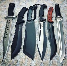 five different types of knifes are on the floor next to each other and one has a red handle