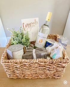 a wicker basket filled with personal care items and a bottle of wine sitting on a table