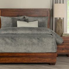 a bed with two nightstands and a night stand