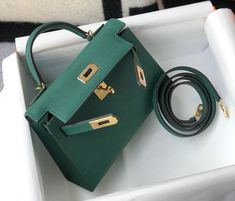 Description HRMS Kelly 19 Green With Gold Toned Hardware Bag For Women, Handbags, Shoulder Bags 7.5in/19cm Rep 1:1 Size: 19 x 11.5 x 5.5 cm / 7.5 x 4.5 x 2.2 inches (Length x Height x Width) Hermès bags are considered the ultimate luxury item worldwide. Each piece is handcrafted with waitlists that can exceed a year or more. The streamlined and demure Kelly style is always in high demand, it is particularly lovely in this vibrant version with gold hardware. Epsom is textured with a wonderful gra Louis Vuitton Shirt, Chanel Shirt, Kelly Bag, Dubai Mall, Hermes Bags, Bag For Women, Fun Bags, Luxury Items, Fashion Handbags