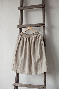 Below the knee skirt is made from 100% soft and washed linen. This Petticoat is perfect for wearing under dress or other skirt or can be worn alone. Match it with our tunics! Details: - Composition: 100% Oeko-Tex certified linen - Colour: natural - Elastic waist - Pockets - Size: One size/fits all - Medium weight linen - Linen care: machine wash gentle; tumble dry low, ironing optional - The price is for one skirt, other pictured items are not included Summer Linen Skirt With Elastic Waistband, Relaxed Linen Skirt With Elastic Waistband, Flowy Linen Skirt With Elastic Waistband, Linen Midi Skirt With Elastic Waistband, Spring Linen Skirted Bottoms, Linen Skirted Bottoms With Pockets, Linen Full Skirt With Elastic Waistband, Skirted Linen Bottoms With Pockets, Full Linen Skirt With Elastic Waistband