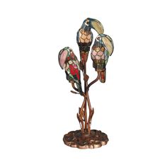 a lamp with three birds sitting on top of it's branches and two flowers