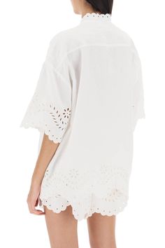 Short-sleeved tunic shirt by Zimmermann crafted in pure linen canvas, enriched by floral cutwork embroideries and scalloped edges. It features mandarin collar and front placket with crochet-covered buttons. Oversized fit with dropped shoulders. The model is 177 cm tall and wears size 1 Zimmermann. Size Info STANDARD Color Detail White Made In China Material 100%LI Season One spring Season Two summer Product clothing Brand Zimmermann Size And Fit Luxury Women's Sets With Cutwork Details, Summer Cotton Blouse With Cutwork, Summer Broderie Anglaise Shirt For Daywear, Elegant Summer Blouse With Cutwork, Summer Blouse With Cutwork Hem And Short Sleeves, Summer Tops With Scalloped Edges For Daywear, Summer Short Sleeve Blouse With Cutwork Hem, Summer Daywear Shirt With Lace Trim, White Cutwork Hem Blouse For Summer