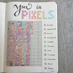 an open notebook with the words year in pixels on it