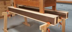 an old wooden church pews are being worked on