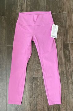 Lululemon Wunder Under HR Tight 25” MGLO Magenta Glow 29869 Size 8 NWT. Designed for: Yoga Hugged sensation: Engineered to feel like a comfortable embrace throughout—it holds you close and moves with you Hidden card pocket : Hidden pocket in waistband holds your key or card No-dig waistband: Soft, no-dig waistband lies flat against your skin High-rise: Keeps you feeling covered and secure Full-on Luxtreme fabric Inseam: 25" Comes from smoke free home. All sales are final so please ask all questi Pink Casual Activewear By Lululemon, Pink Functional Lululemon Activewear, Pink Lululemon Activewear For Yoga, Pink Functional Activewear By Lululemon, Pink Lululemon Activewear For Workout, Lululemon Pink Activewear For Pilates, Lululemon Pink Workout Activewear, Pink Lululemon Activewear With Go-dry Technology, Pink Lululemon Moisture-wicking Activewear