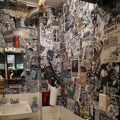 a bathroom with black and white wall paper