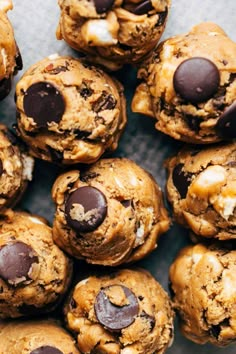 chocolate chip cookies are piled on top of each other