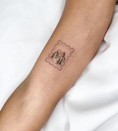 a person with a small tattoo on their arm