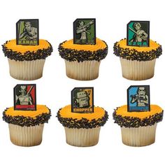 star wars cupcakes with yellow frosting and black sprinkles