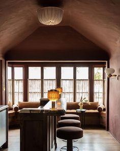 a living room filled with furniture next to a window