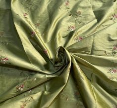 A beautiful Designer 100% Silk Taffeta Dupioni in the a gorgeous shade of Pistachio Green with pink and ivory floral embroidered vines that cascade down the face of the fabric in rows. Can be used for interior decorating, pillows, duvets, curtains, or dress and skirts garments as well as costumes. Sold by the yard. 55" Wide. Will combine shipping. Photo on the right is for inspirational purposes only, and is not made of the actual fabric being sold. We do not accept returns on fabric. We offer s Embroidery Vines, Embroidered Vines, Decorating Pillows, Valley Village, Silk Dupioni, Italian Garden, Silk Fabrics, Pistachio Green, Silk Taffeta