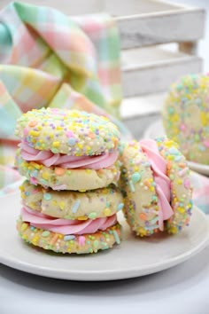 a stack of cookies with sprinkles on a plate