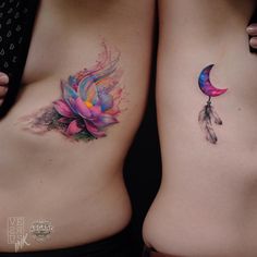 two women with tattoos on their stomachs, one has a flower and the other has a feather