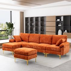 an orange couch and ottoman in a living room