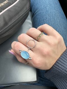 When I say that I have not taken this off since I made the first sample, I mean it! The bright silver pairs so well with the sky-like tone of blue in this gemstone. This stunning blue chalcedony ring is made of sterling silver material. The stone is 16mmx12mm. If you're into it: A creative stone, Blue Chalcedony imparts mental flexibility and verbal dexterity. It stimulates the ability to learn new languages and improves memory. Gives feelings of light-heartedness and optimism. Improves self-per Celestial Silver Rings With Gemstone Accents, Adjustable Blue Ring With Gemstone Accents, Blue Chalcedony Round Jewelry, Blue Moonstone Promise Ring, Blue Moonstone Birthstone Ring, Oval Blue Sterling Silver Stackable Rings, Blue Opal Open Ring In Sterling Silver, Blue Moonstone Crystal Ring As Gift, Blue Moonstone Round Rings