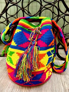 "These beautifully handcrafted crossbody bags are handwoven by Columbian Artisans, each with unique and exclusive designs, with bright colors or tan/brown color scheme. Each bag is approximately 11\" wide x 12\" high with strap size approximately 36\" long (each bag may vary by 1 inch or so)." Brown Color Scheme, Goddess Of The Sea, Brown Color Schemes, Handmade Bags, Sling Bag, Tan Brown, Crossbody Shoulder Bag, Crochet Bag, Color Scheme