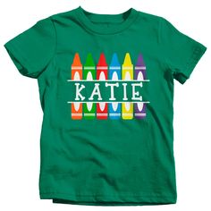 "Kids Personalized Back To School T Shirt Crayon Shirts Custom T Shirt Custom School Shirts Crayons This personalized birthday shirt is perfect for back to school! This design features colorful split crayons and will be personalized with your child's name. Make it easier for the teacher to remember your son or daughter's name this season with a personalized shirt! A great custom school shirt for elementary or pre-school aged children. TERMS FOR PERSONALIZED ITEMS: A proof will be provided to you Cute Green T-shirt With Custom Print, Customizable Green T-shirt For Birthday, Green Custom Print T-shirt For Birthday, Fun Green T-shirt For School, Fun Green T-shirt For Birthday, Cute Green Tops With Name Print, Green Fun Birthday T-shirt, Green Crew Neck Birthday Shirt, Customizable Green Short Sleeve Tops