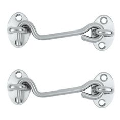 two chrome door handles with latches on each side and one has an oval handle