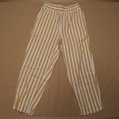 Yellow And White Striped Elastic Waist Cropped Linen Pants With Front Pockets. Never Worn. Length From Front Waist To Ankle: 34 Inches Inseam: 24 Inches 55% Linen, 45% Cotton Yellow Pants With Elastic Waistband, Yellow Straight Pants With Elastic Waistband, Yellow Summer Pants With Pockets, Yellow Ankle-length Pants With Pockets, Ankle-length Yellow Pants With Pockets, Yellow Vacation Pants With Pockets, Yellow Loungewear Bottoms With Pockets, Yellow Bottoms With Pockets For Loungewear, Casual Mustard Bottoms For Loungewear