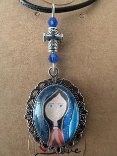 Beautiful religious artwork of Virgin Madonna  pendant by Arte Lilia and handmade by Karen G . Spiritual Pendant Necklace With Artistic Design, Spiritual Crucifix Necklace For Memorial, Handmade Memorial Necklace With Oval Pendant, Artisan Crucifix Necklace For Gift, Our Lady Of Guadalupe Round Pendant As Gift, Bohemian Crucifix Necklace, Spiritual Our Lady Of Guadalupe Pendant Necklace, Bohemian Crucifix Necklace As Gift, Bohemian Crucifix Necklace As A Gift