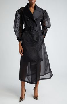 Voluminous puff sleeves and wide lapels frame this double-breasted trench coat crafted of sheer silk-kissed fabric in the label's signature black. Double-breasted button closure Notched lapels Belted cuffs Front welt pockets Unlined 80% nylon, 16% silk, 4% polyester Dry clean Made in Italy Designer Clothing Sheer Trench Coat, Fall Wardrobe Essentials, Double Breasted Trench Coat, Caftan Dress, Romantic Dress, Made Clothing, Designer Clothes For Men, Inspired Dress, Comfortable Dress