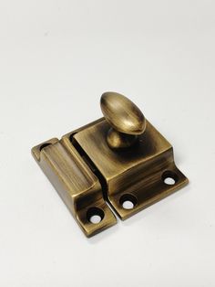 an antique brass door handle on a white background