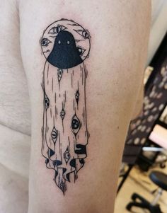 a black and white tattoo on the arm of a woman's left arm with an image of a mushroom