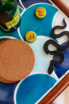 a close up of a tray with some buttons and letters on it's surface