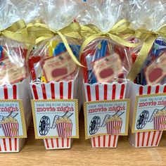 small popcorn bags are lined up on a table