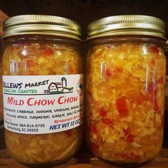 two jars filled with food sitting on top of a table