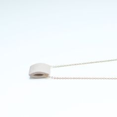 In stock & ready to ship. Individually handcrafted, sculptural, pigmented porcelain pendant on a 16 inch, 14k gold fill chain. GRAMMAR pieces are designed to be minimal, so that you'll wear them often and easily, making them a staple in your wardrobe. Individually artist-handcrafted, durable & natural material. 22 inch, 14 karat gold fill chain. Ceramic pendant is approximately 1/2" wide. Small batch, energy conscious production. Lifetime repair, replacement and service options. Create a set wit Modern White Necklace With Cable Chain, Everyday White Necklace With Adjustable Chain, White Necklace With Adjustable Chain For Everyday, Everyday White Rectangular Pendant Necklace, White Modern Necklace With Adjustable Chain, Modern White Necklaces For Everyday, Minimalist Everyday Beige Jewelry, Everyday Minimalist Beige Jewelry, Pocket Necklace