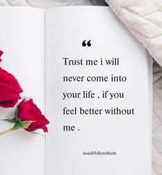 a red rose sitting on top of an open book next to a white blanket with the words trust me i will never come into your life if you feel better without me