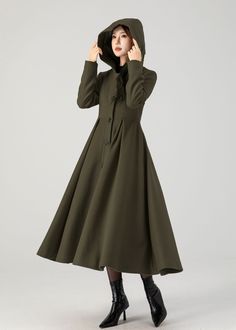 Upgrade your outerwear collection with our army green wool coat, complete with a hood and a single-breasted button closure. The army green is versatile and easy to pair with various outfits.  Details  * 50% wool blend, 50% fiber,nylon * A matching smooth satiny lining * Two standard size side seam pockets * Front Buttons closure  * Long wool coat * Hooded coat * Fit and flare coat * Swing coat * Daily coat * Perfect for autumn winter * Dry clean  * More color choose No 1:  https://etsy.me/4fGTZ6f MODEL SIZE Bust 85 cm(33.4") Waist 67 cm(26.7") Height 168cm (5' 6") She wears size XS Choose CUSTOM Order if you * Need a better fit * Can't find your size in our size Chart * Change the Style * Chang the Length * Your Height is not Between 5'1" - 5"9" * Your weight is over 75 kg SIZE GUIDE Size Green Wool Coat For Winter, Khaki Double-breasted Pea Coat For Winter, Khaki Wool Coat With Pockets For Winter, Khaki Long Wool Coat For Fall, Winter Khaki Pea Coat With Button Closure, Khaki Pea Coat With Button Closure For Winter, Hooded Wool Coat With Buttons For Fall, Military Style Single Breasted Winter Outerwear, Military Style Single-breasted Winter Outerwear