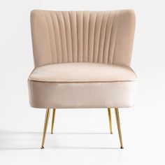 a beige chair with gold legs on a white background