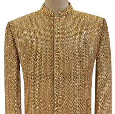 Description Make your wedding day truly memorable with Uomo Attire's fully micro embellished golden sherwani. This luxurious sherwani is made from premium quality fabric and features intricate micro embellishments that will make you stand out from the crowd. The sherwani is fully micro embellished with beautiful designs that will make you look like a king. It has a straight bottom fashion and half round ban which complete the look of this sherwani. To complete the look, wear the sherwani with sa Designer Bandhgala With Gota Work For Wedding, Designer Wedding Bandhgala With Gota Work, Gold Traditional Wear With Mirror Work For Formal Occasions, Gold Festive Kurta For Reception, Festive Gold Sherwani With Gota Work, Festive Gold Kurta For Reception, Bollywood Style Ceremonial Bandhgala With Gota Work, Gold Fitted Sherwani For Festive Occasions, Bollywood Bandhgala With Gold Embroidery For Reception