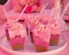 small cupcakes with pink frosting on a plate